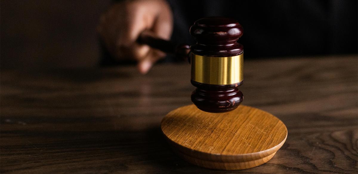A gavel on a wooden block