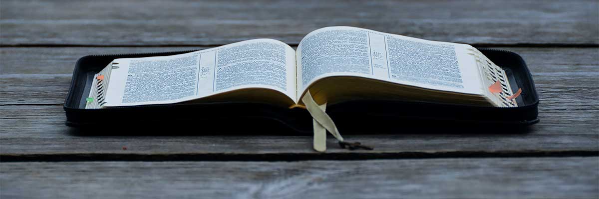 Open Bible on wooden table