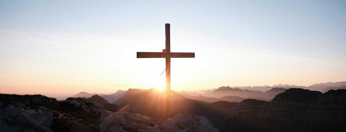 Cross at sunrise photo