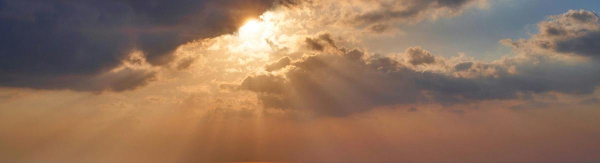 Sun shining through clouds